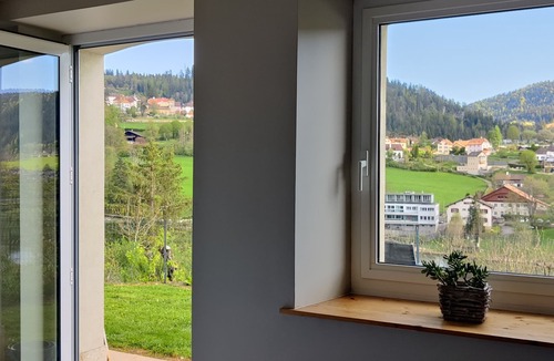 Villers-le-Lac Apartment | "Balcony overlooking the Doubs Basin and the Swiss village of Les Brenets