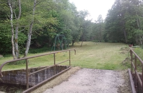 Escles House | Former flour mill with pond on wooded grounds