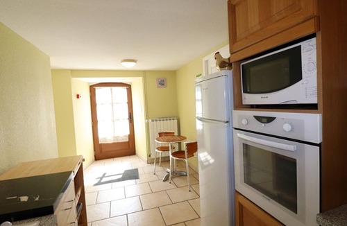 La Trinitat Cottage | Historic 4-bedroom house with fireplace, enclosed garden and pets allowed