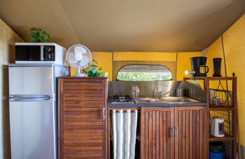 Bessuejouls RV Rental | Wooden Chalet in Bessuéjouls – Glamping Lodge with Private Terrace, Garden, and Mountain View