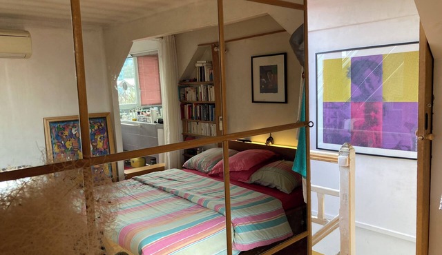 Bedroom, bathroom and terrace in artist's loft-atelier.