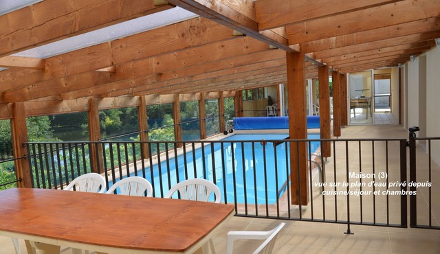 House with pool under conservatory, large terrace overlooking the private pond
